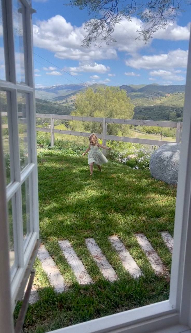 Child playing in the cottage yard